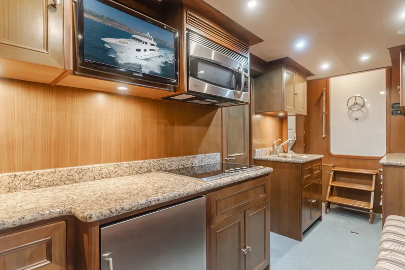 Harley G Yacht Photos Pics Luxurious kitchen interior of 2014 TransWorld 116' yacht with granite countertops and modern appliances.