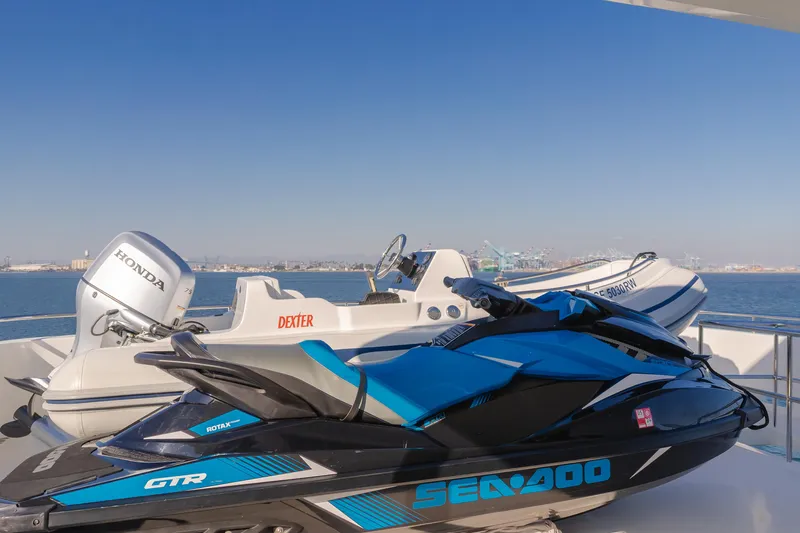Harley G Yacht Photos Pics Jet ski and boat on TransWorld 116' yacht, 2014 model, with ocean backdrop.