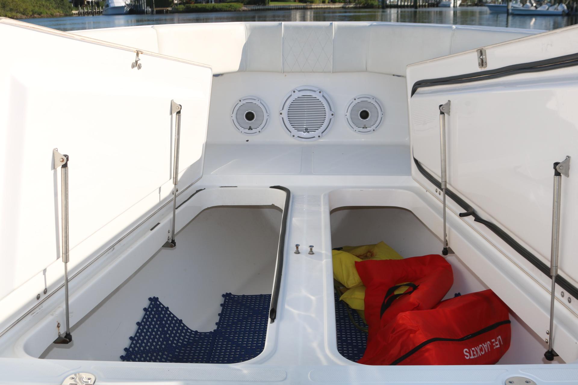 2008 Venture 39 Center Console boat storage compartments with life jackets.