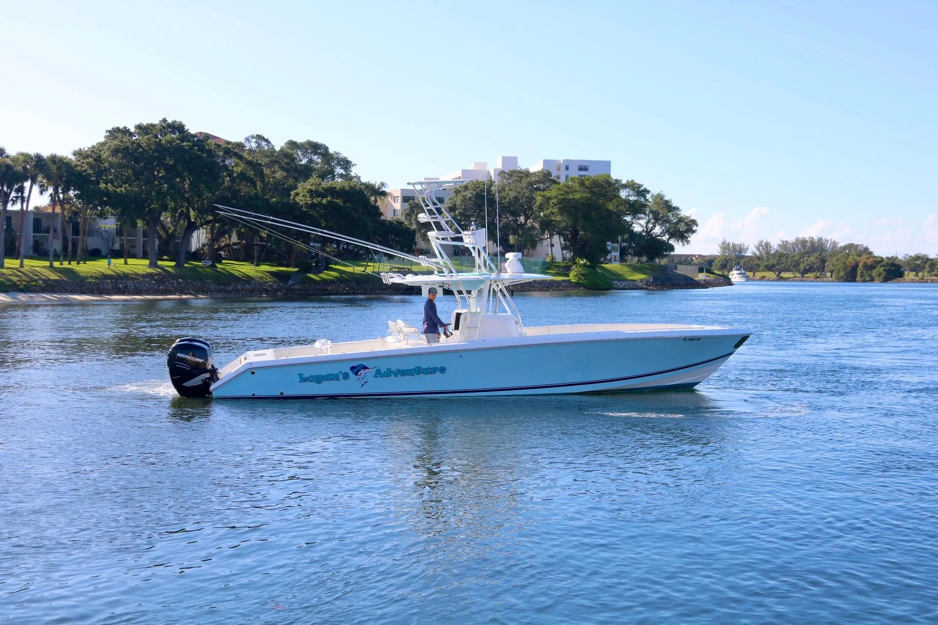 2008 Venture 39 Center Console boat cruising on a calm river.