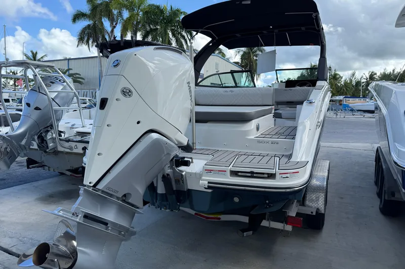  Yacht Photos Pics 2025 Sea Ray SDX 270 Outboard boat with sleek design, docked at marina.