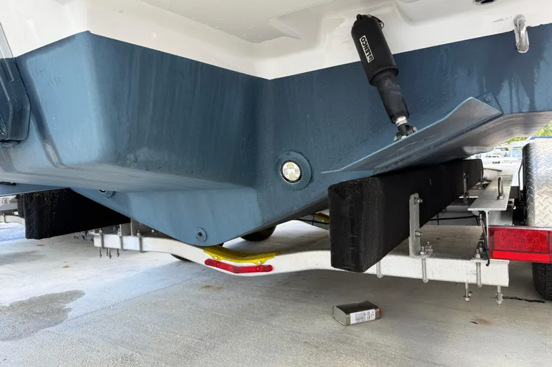  Yacht Photos Pics 2025 Sea Ray SDX 270 Outboard boat on trailer, showing hull and trailer details.