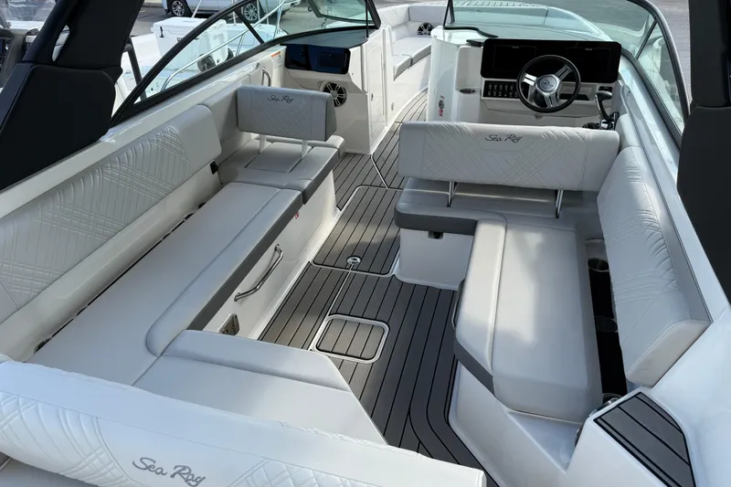  Yacht Photos Pics 2025 Sea Ray SDX 270 Outboard boat interior with luxurious seating and modern design.