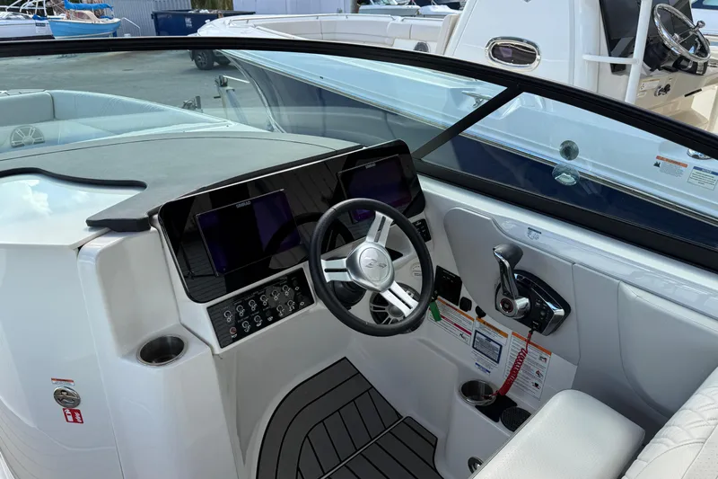 Yacht Photos Pics 2025 Sea Ray SDX 270 Outboard boat cockpit with modern steering and controls.