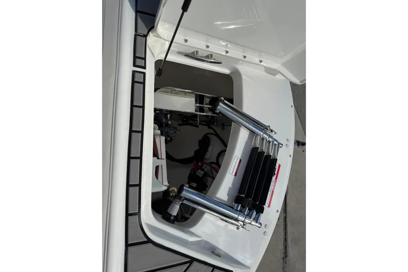  Yacht Photos Pics 2025 Sea Ray SDX 270 Outboard boat storage compartment with hydraulic components.