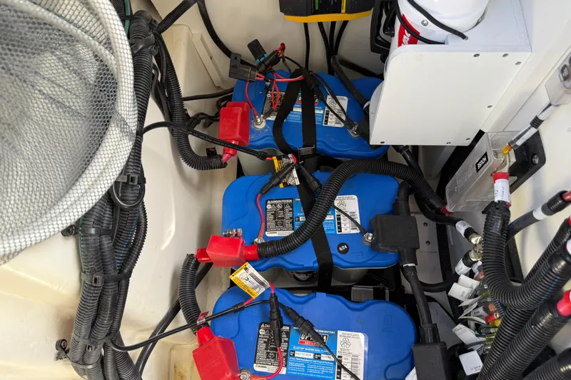  Yacht Photos Pics Battery compartment of 2025 Sea Ray SDX 270 Outboard with wiring and connections.