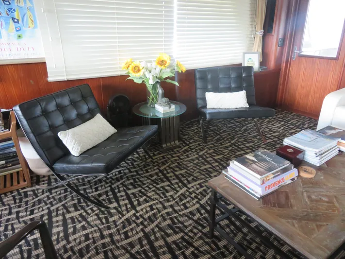 Rive' Gauche Yacht Photos Pics Interior of 1986 Hatteras 58 Motor Yacht with modern chairs and sunflowers.