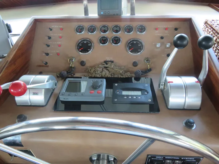 Rive' Gauche Yacht Photos Pics Control panel of a 1986 Hatteras 58 Motor Yacht with gauges and levers.
