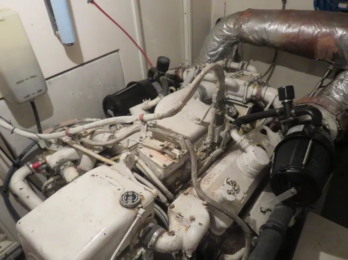 Rive' Gauche Yacht Photos Pics Engine room of a 1986 Hatteras 58 Motor Yacht, showcasing mechanical components.