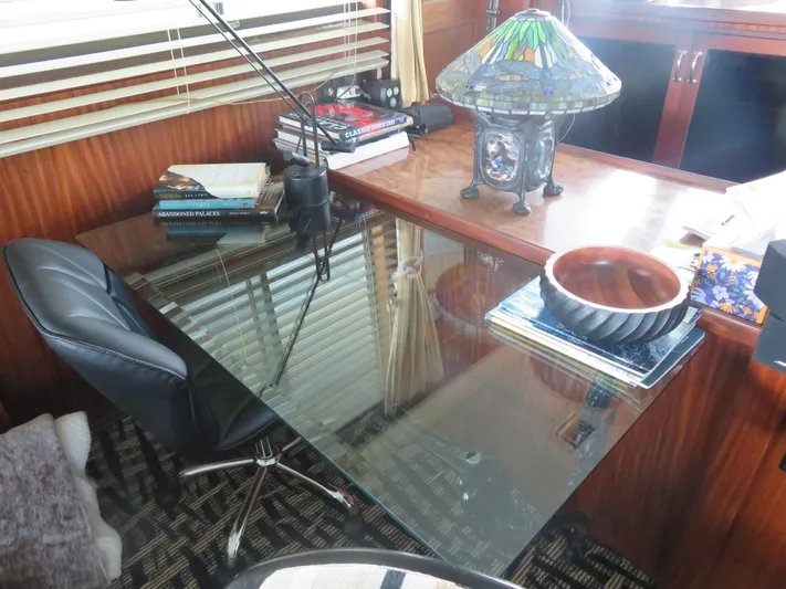 Rive' Gauche Yacht Photos Pics Office space on 1986 Hatteras 58 Motor Yacht with glass desk and decorative lamp.