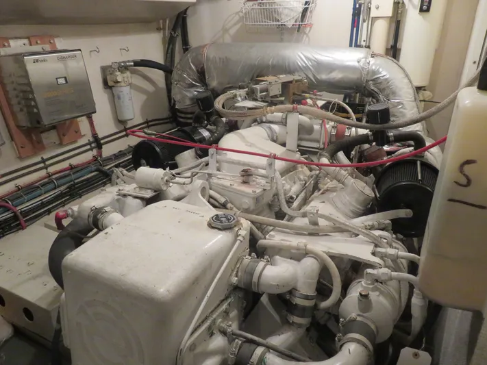 Rive' Gauche Yacht Photos Pics Engine room of a 1986 Hatteras 58 Motor Yacht with visible machinery and components.