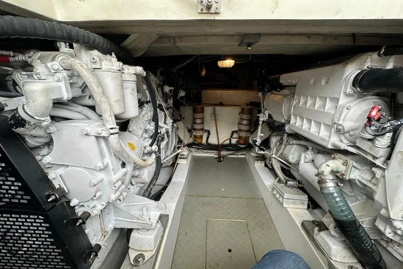  Yacht Photos Pics Engine room of a 2003 Ferretti Yachts 430, showcasing dual engines and mechanical components.