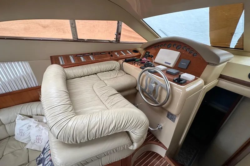  Yacht Photos Pics Luxurious 2003 Ferretti Yachts 430 helm with leather seating and modern controls.