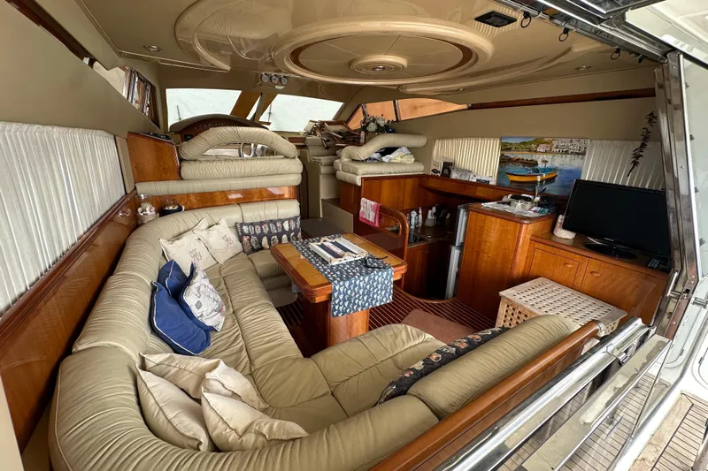  Yacht Photos Pics Luxurious interior of a 2003 Ferretti Yachts 430 with plush seating and elegant decor.