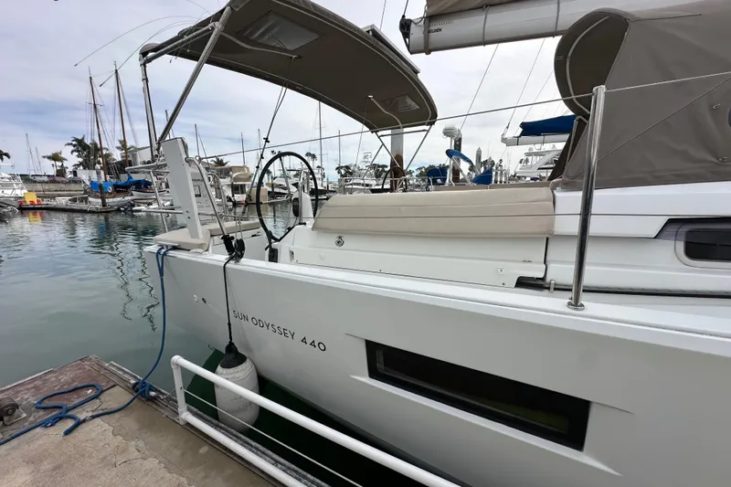  Yacht Photos Pics 2019 Jeanneau Sun Odyssey 440 sailboat docked at marina, featuring sleek design and spacious deck.