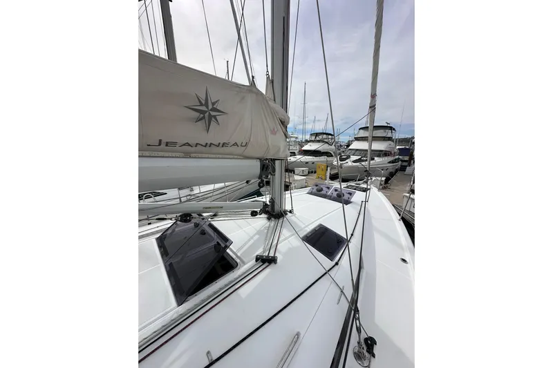  Yacht Photos Pics 2019 Jeanneau Sun Odyssey 440 sailboat docked, showcasing sleek deck and rigging.