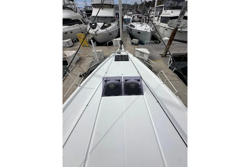  Yacht Photos Pics 2019 Jeanneau Sun Odyssey 440 yacht docked at marina, showcasing sleek deck design.