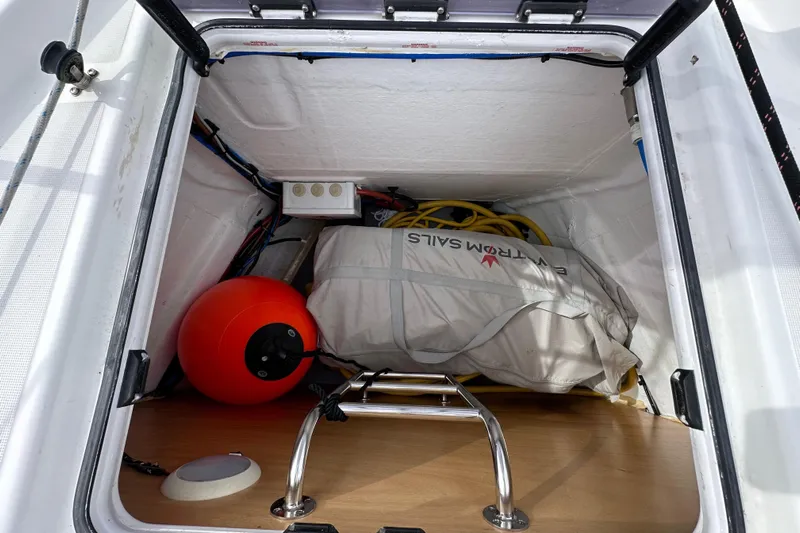  Yacht Photos Pics Storage compartment of 2019 Jeanneau Sun Odyssey 440 with sailing gear and equipment.