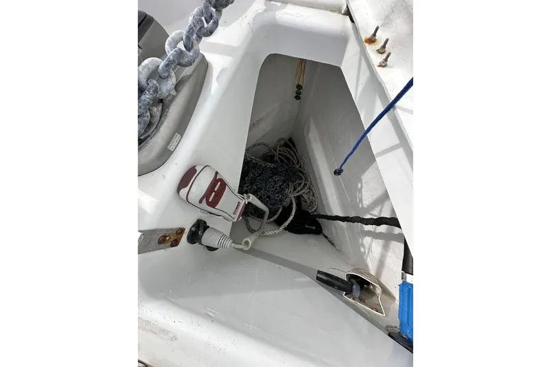  Yacht Photos Pics Anchor locker of 2019 Jeanneau Sun Odyssey 440 sailboat with chain and ropes.