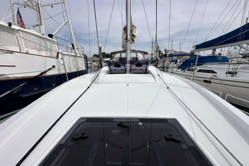  Yacht Photos Pics 2019 Jeanneau Sun Odyssey 440 sailboat docked at marina, view of deck and mast.