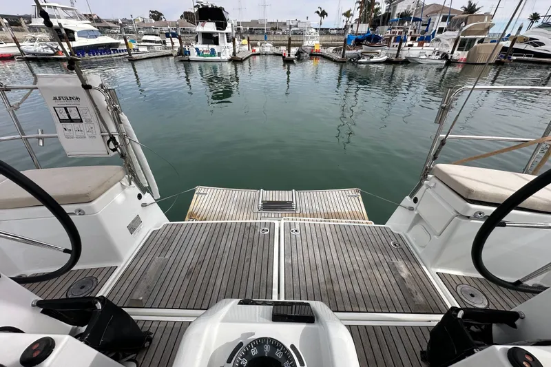  Yacht Photos Pics 2019 Jeanneau Sun Odyssey 440 yacht deck overlooking marina with boats.