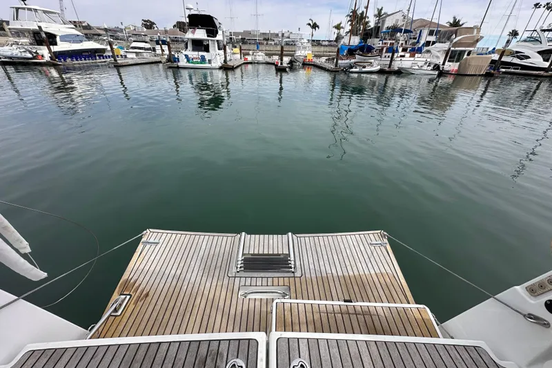  Yacht Photos Pics Jeanneau Sun Odyssey 440, 2019 model, docked at a marina with calm waters.