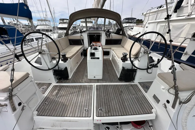  Yacht Photos Pics 2019 Jeanneau Sun Odyssey 440 sailboat cockpit with dual steering wheels and spacious seating.