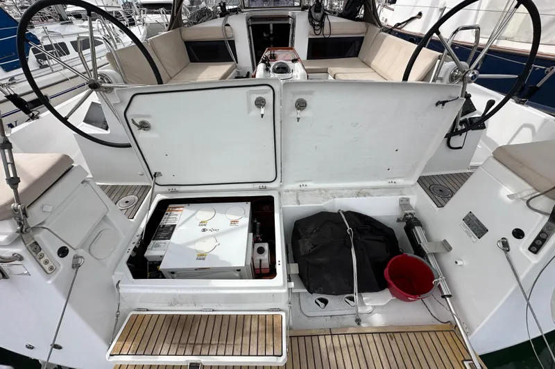  Yacht Photos Pics Cockpit of 2019 Jeanneau Sun Odyssey 440 sailboat with open storage compartments.