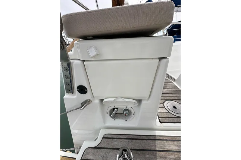  Yacht Photos Pics 2019 Jeanneau Sun Odyssey 440 cockpit detail with cushioned seating and control panel.