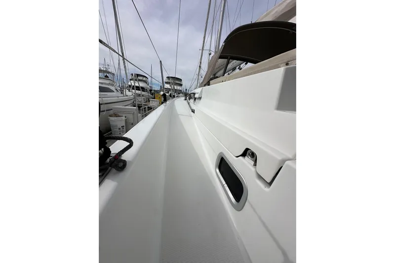  Yacht Photos Pics 2019 Jeanneau Sun Odyssey 440 sailboat deck view at marina.