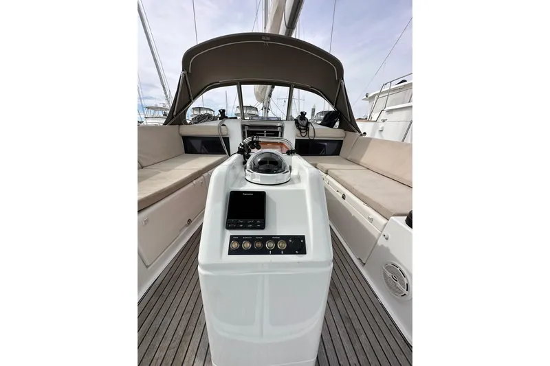  Yacht Photos Pics 2019 Jeanneau Sun Odyssey 440 cockpit with helm, seating, and navigation equipment.