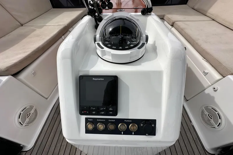  Yacht Photos Pics Cockpit of 2019 Jeanneau Sun Odyssey 440 with compass and Raymarine navigation system.