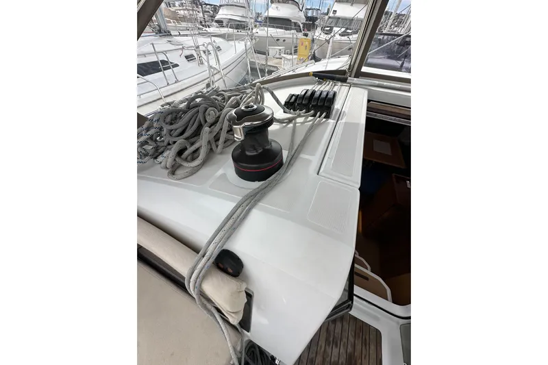  Yacht Photos Pics 2019 Jeanneau Sun Odyssey 440 deck with winch and ropes in marina setting.