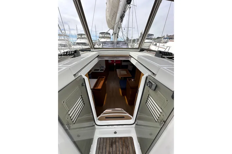  Yacht Photos Pics 2019 Jeanneau Sun Odyssey 440 interior view with open cabin doors.
