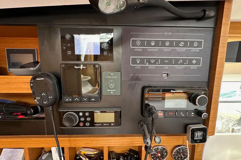  Yacht Photos Pics Control panel of a 2019 Jeanneau Sun Odyssey 440 sailboat with navigation and communication equipment.