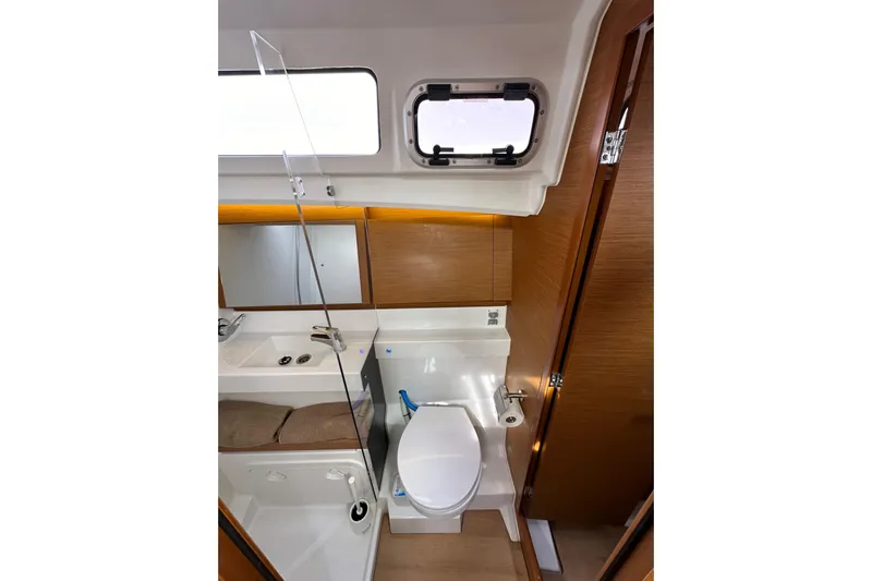  Yacht Photos Pics Interior of 2019 Jeanneau Sun Odyssey 440 yacht bathroom with modern fixtures.