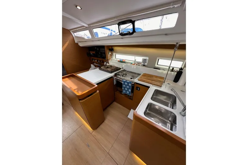 Yacht Photos Pics Interior of 2019 Jeanneau Sun Odyssey 440 yacht kitchen with modern amenities.