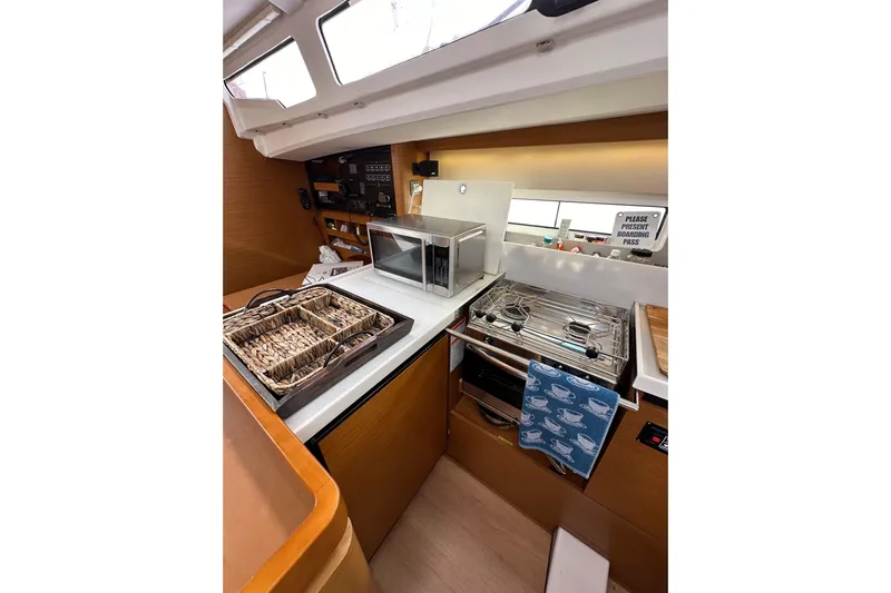  Yacht Photos Pics Modern kitchen in 2019 Jeanneau Sun Odyssey 440 yacht with stove and microwave.