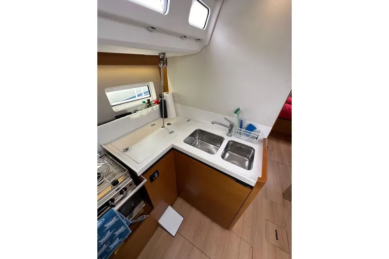  Yacht Photos Pics Modern kitchen in 2019 Jeanneau Sun Odyssey 440 yacht with dual sinks and stove.