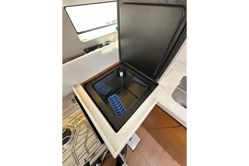  Yacht Photos Pics Open fridge compartment in 2019 Jeanneau Sun Odyssey 440 yacht galley.