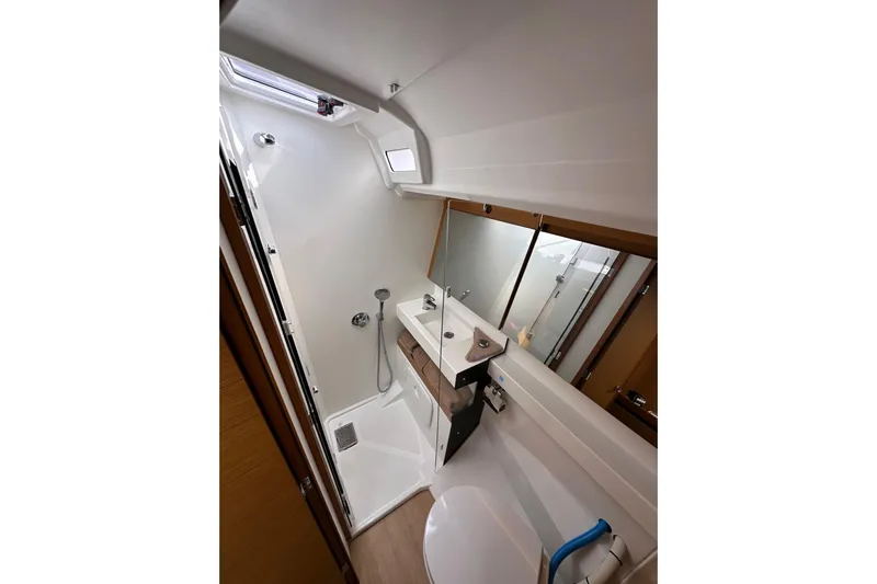  Yacht Photos Pics Bathroom interior of 2019 Jeanneau Sun Odyssey 440 yacht, featuring modern fixtures and shower.