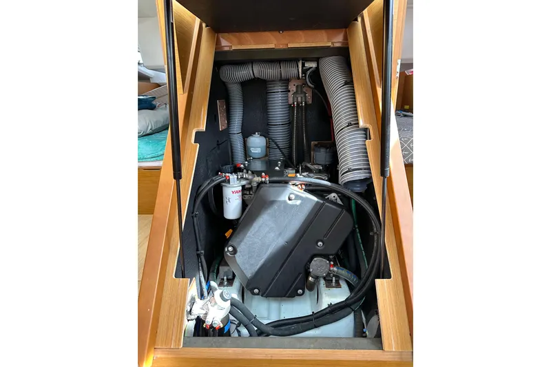  Yacht Photos Pics Engine compartment of 2019 Jeanneau Sun Odyssey 440 sailboat, showcasing mechanical components.