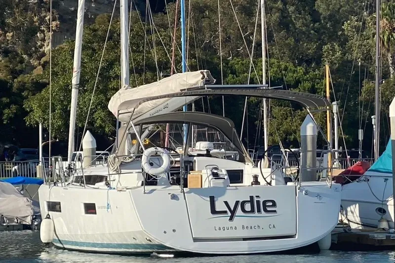  Yacht Photos Pics 2019 Jeanneau Sun Odyssey 440 sailboat docked in a marina, named "Lydie."