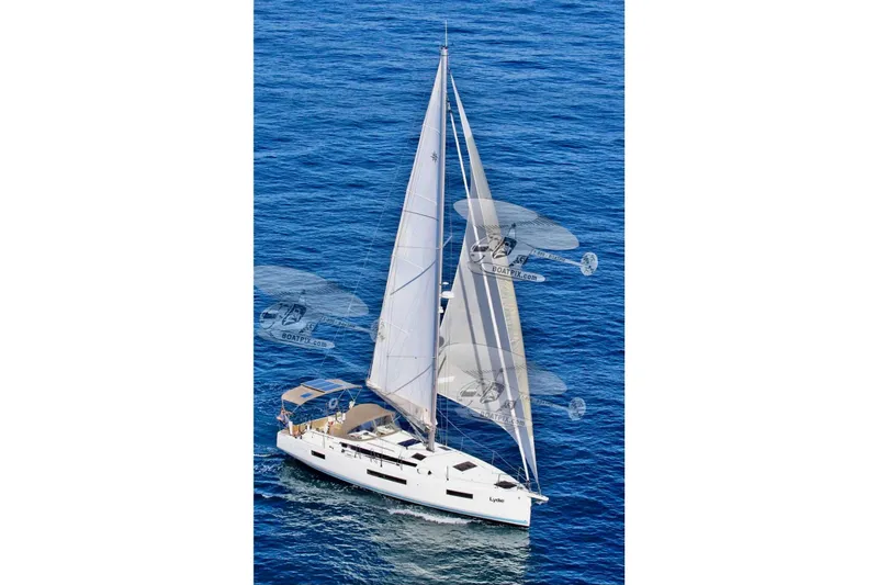  Yacht Photos Pics 2019 Jeanneau Sun Odyssey 440 sailing on open blue sea.