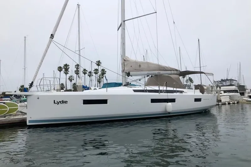  Yacht Photos Pics 2019 Jeanneau Sun Odyssey 440 sailboat docked in marina, overcast sky.