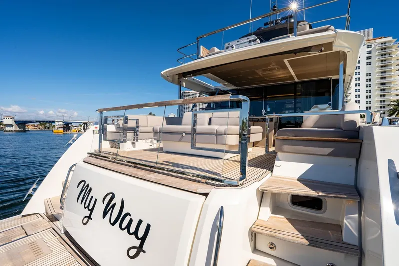  Yacht Photos Pics Luxury 2022 Prestige X70 yacht "My Way" docked, featuring elegant outdoor seating.
