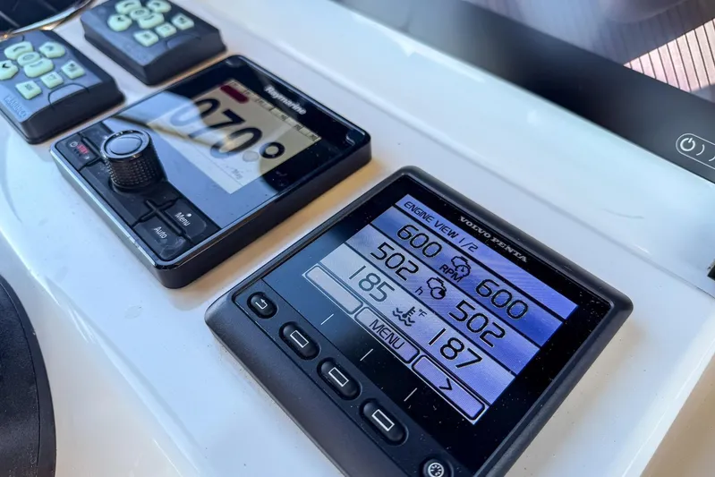  Yacht Photos Pics Control panel of a 2022 Prestige X70 yacht displaying engine and navigation data.