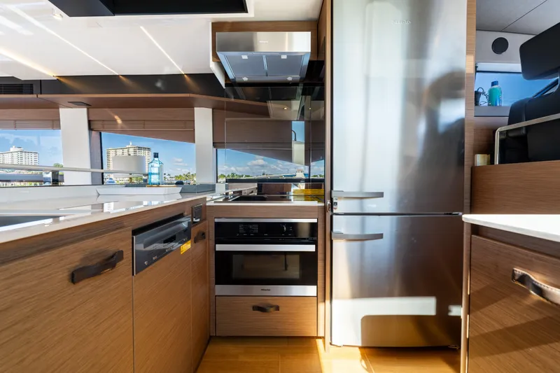  Yacht Photos Pics Modern kitchen interior on 2022 Prestige X70 yacht with stainless steel appliances.