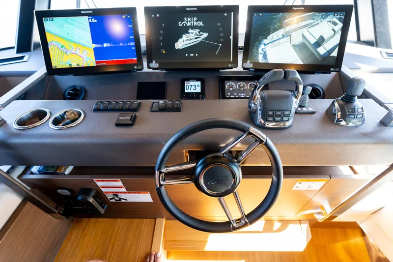  Yacht Photos Pics Prestige X70 2022 yacht helm with advanced navigation displays and controls.