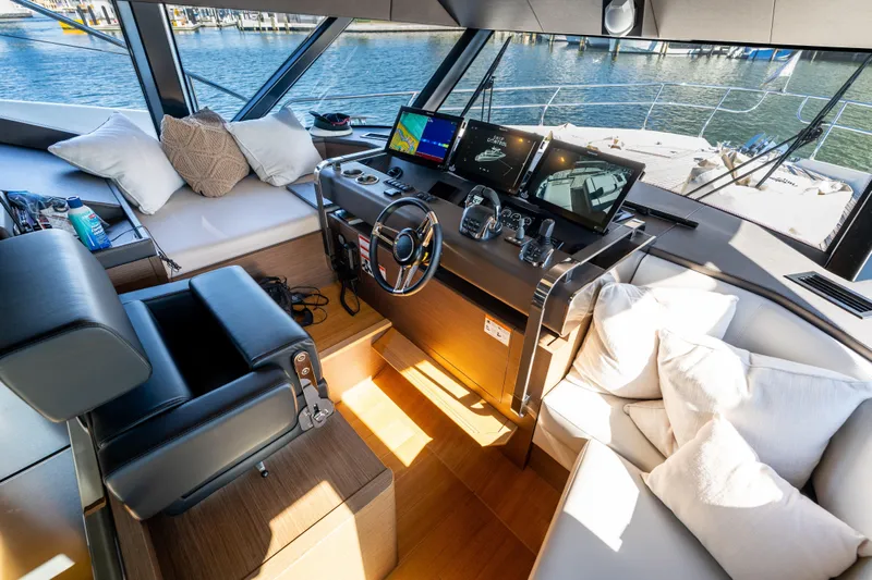  Yacht Photos Pics Luxurious 2022 Prestige X70 yacht interior with modern helm and plush seating.